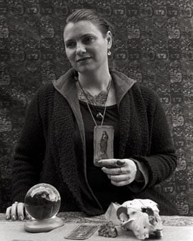 Courtney Carnrite with tarot card and crystal ball